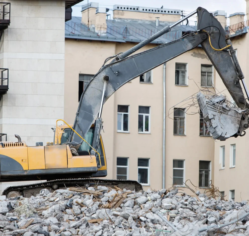 building-demolition-with-hydraulic-excavator-destr-2026-01-08-06-13-42-utc (1)