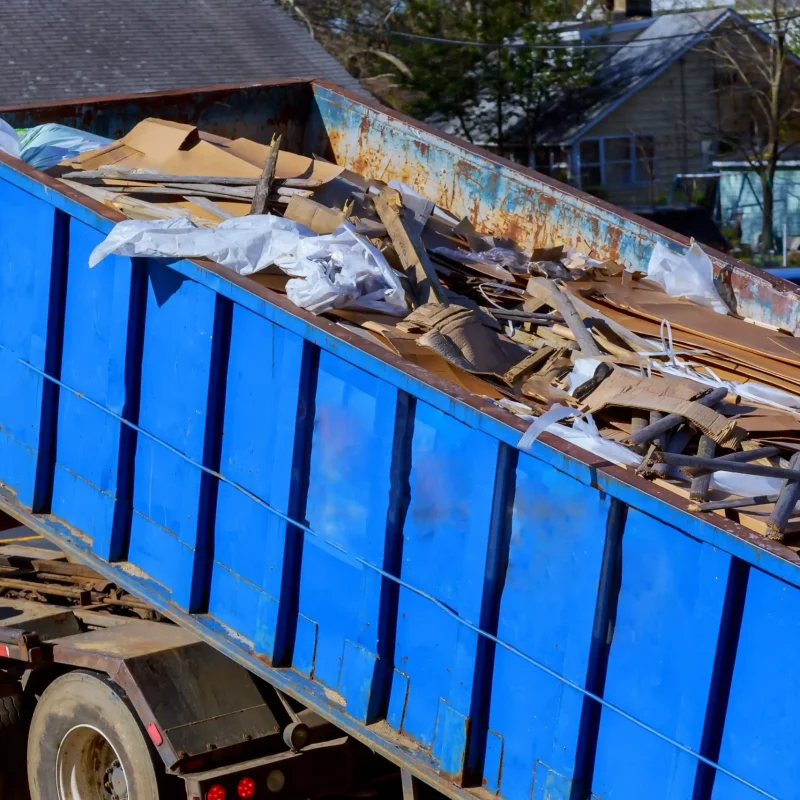 construction-debris-in-blue-dumpster-in-suburban-s-2026-01-09-08-29-51-utc